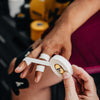 Person using a digital hand size measuring device with a blurred background